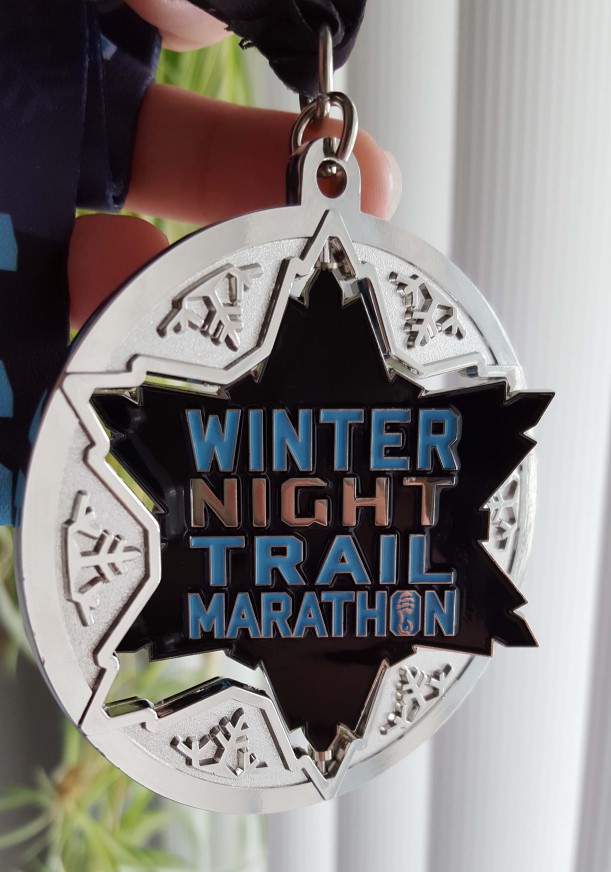 Medal from the Winter Night Trail Marathon 2016.